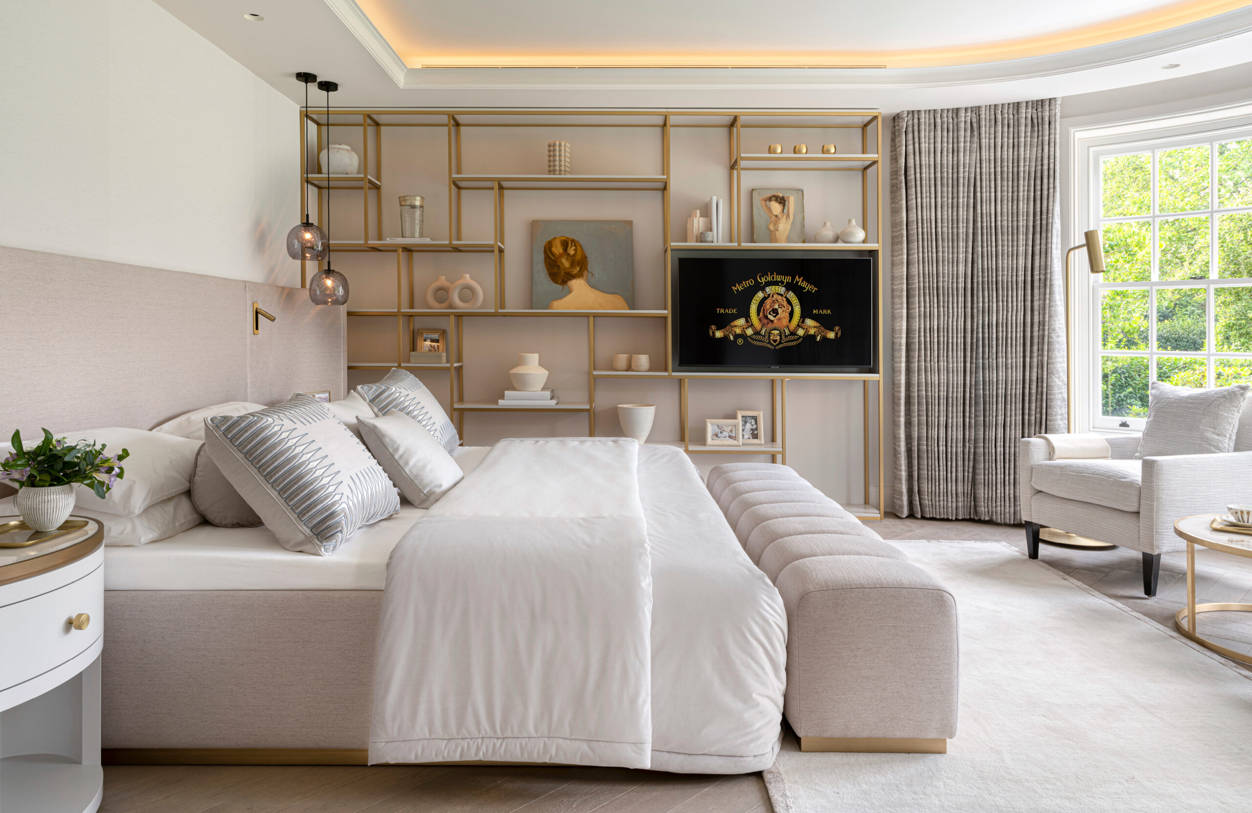 Master bedroom suite in with rich textures and brass details