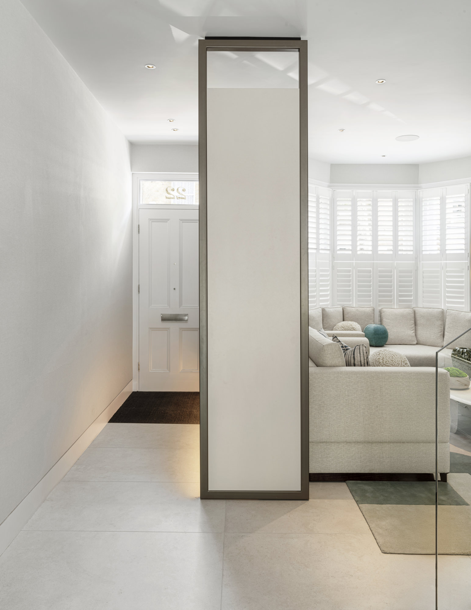 Chelsea Townhouse - LLI Design - Entrance Hall - Dividing living room with bespoke coats storage unit