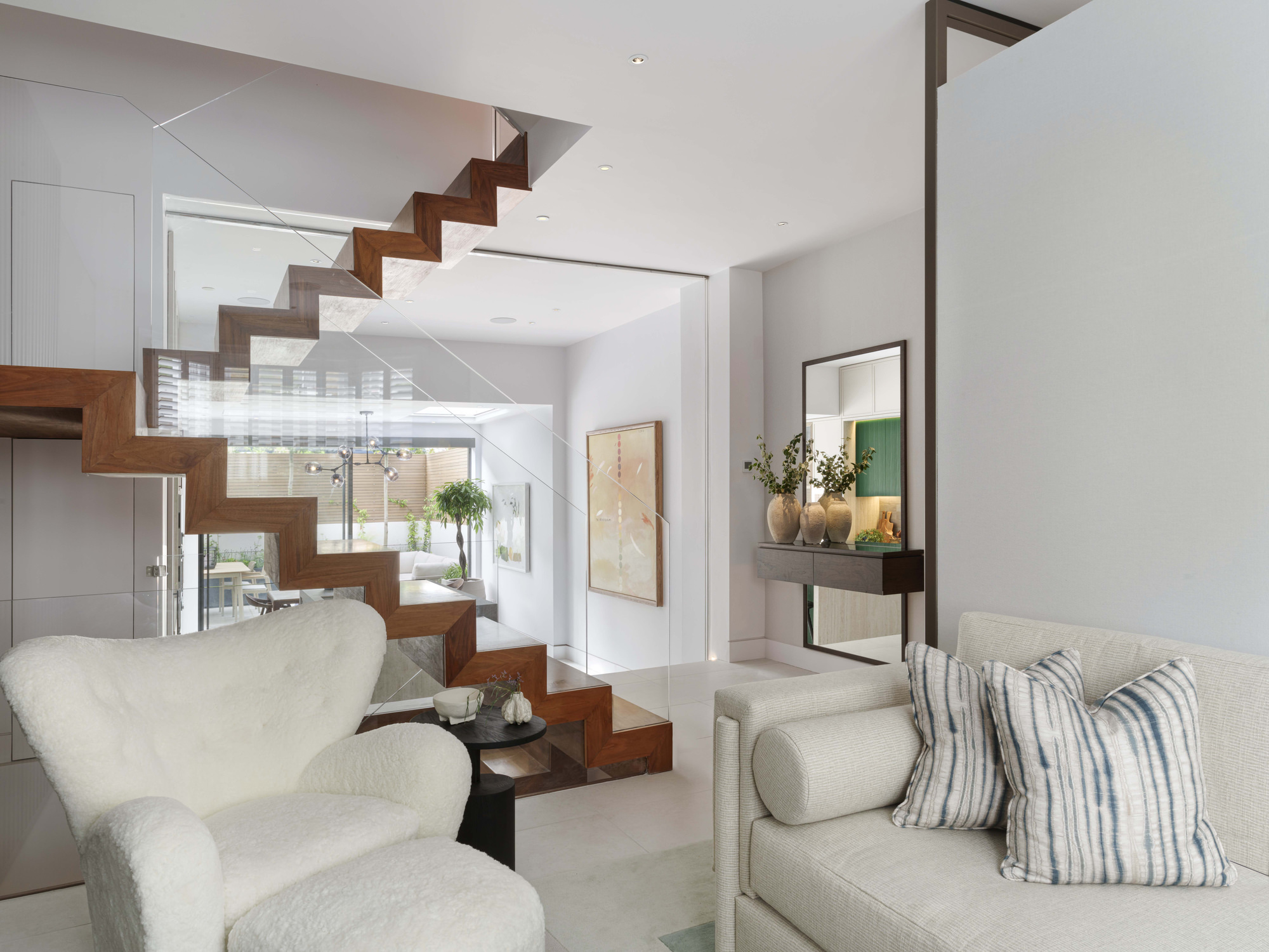 Chelsea Townhouse - LLI Design - Living Room - Overview with view to bespoke staircase and kitchen beyond