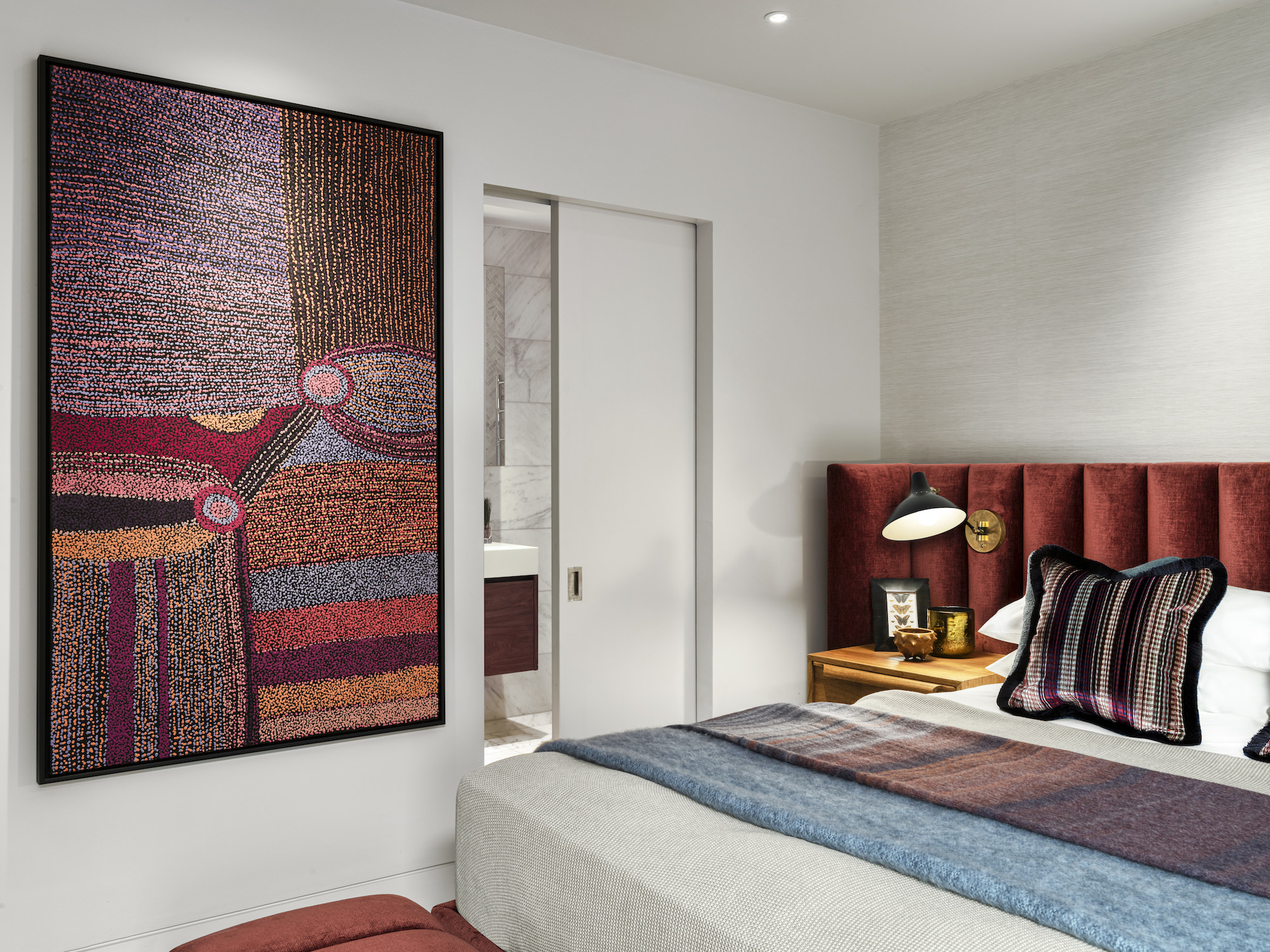 Chelsea Townhouse - LLI Design - Guest Bedroom - Overview with curated artwork and ensuite beyond