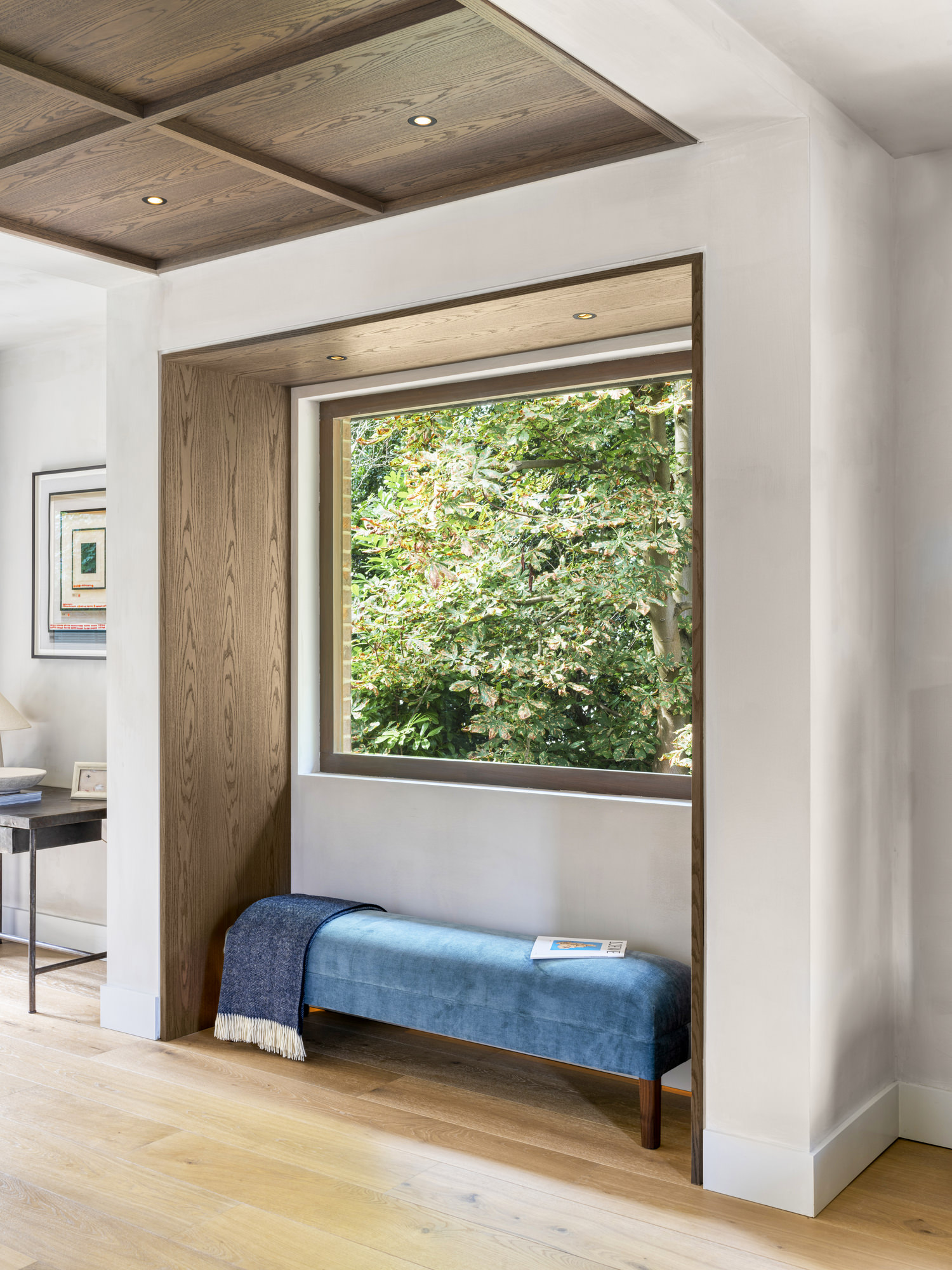 Highgate Minimal Modernism - LLI Design - Living room - dark timber veneer window soffit and ceiling overview with upholstered bench seating