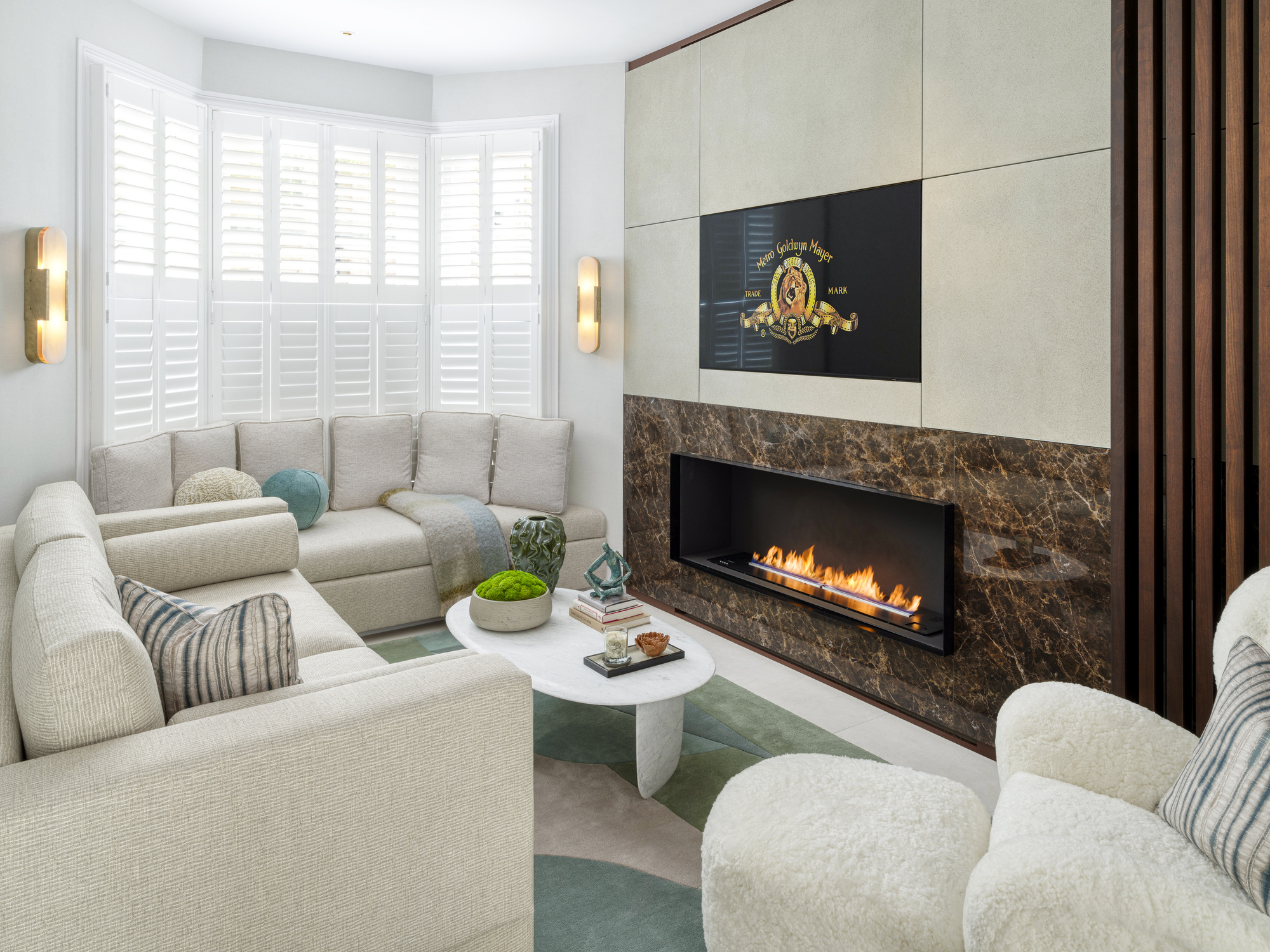 Chelsea Townhouse - LLI Design - Living Room - Overview 1 - Bespoke stone clad unit with fireplace and integrated hidden TV - TV open
