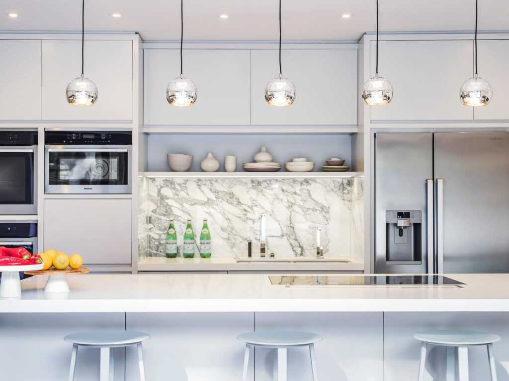LLI Design - Portfolio Tile - 4 Family townhouse, Highgate: bespoke kitchen with marble splashback and island seating