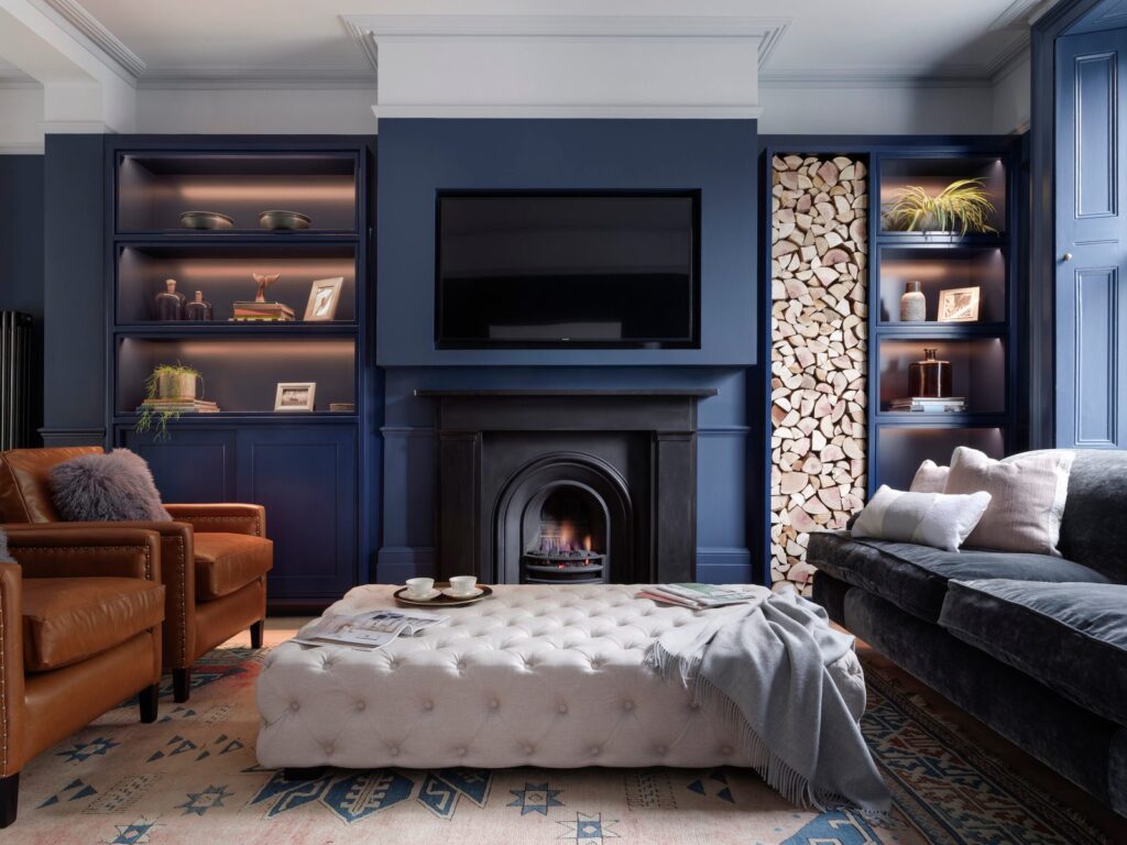 LLI Design - Portfolio Tile - 7 Victorian townhouse, Highgate: reception room with navy joinery, fireplace and log store